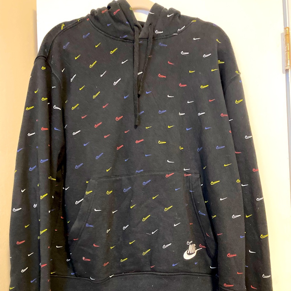 I am selling a black Nike hoodie with different color Nike signs.